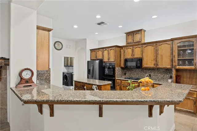 a kitchen with granite countertop living room