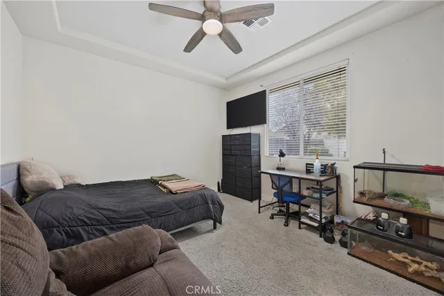 a bedroom with furniture and a window