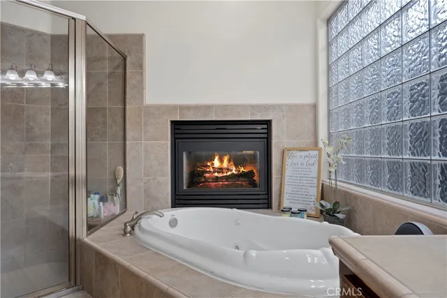 a bathroom with a bathtub and a shower