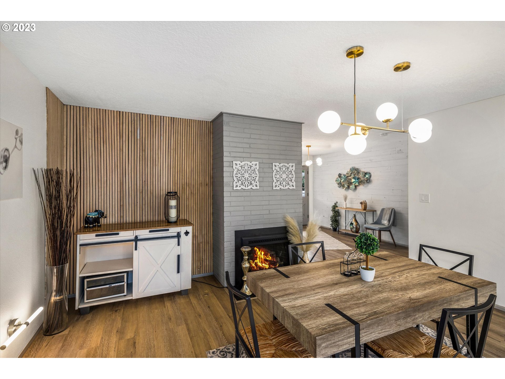 16331 Southeast Salmon Street Portland, OR 97233 - Photo 16 of 40 a kitchen with stainless steel appliances kitchen island granite countertop a stove a sink dishwasher and white cabinets with wooden floor