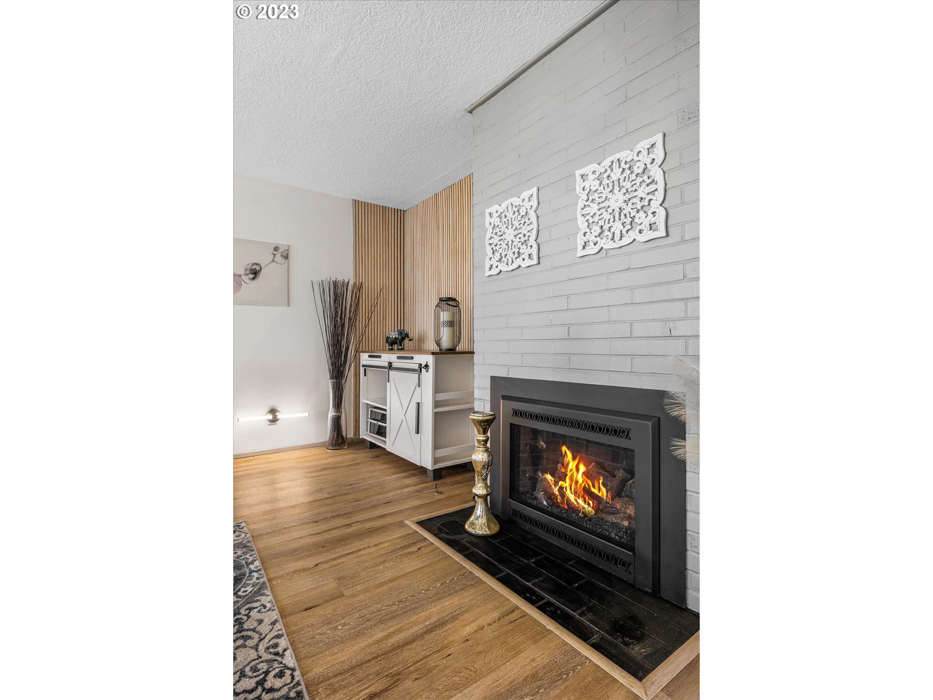 16331 Southeast Salmon Street Portland, OR 97233 - Photo 18 of 40 a living room with furniture and a fireplace