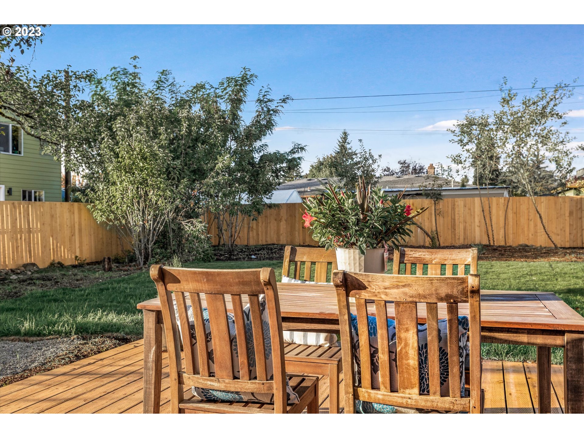 16331 Southeast Salmon Street Portland, OR 97233 - Photo 22 of 40 a view of a chairs and table on the wooden deck