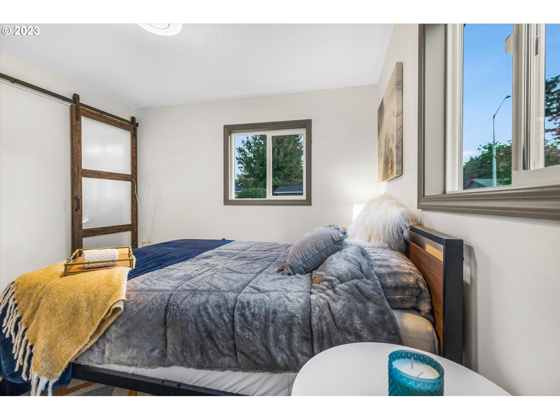 16331 Southeast Salmon Street Portland, OR 97233 - Photo 28 of 40 a bedroom with a bed and window