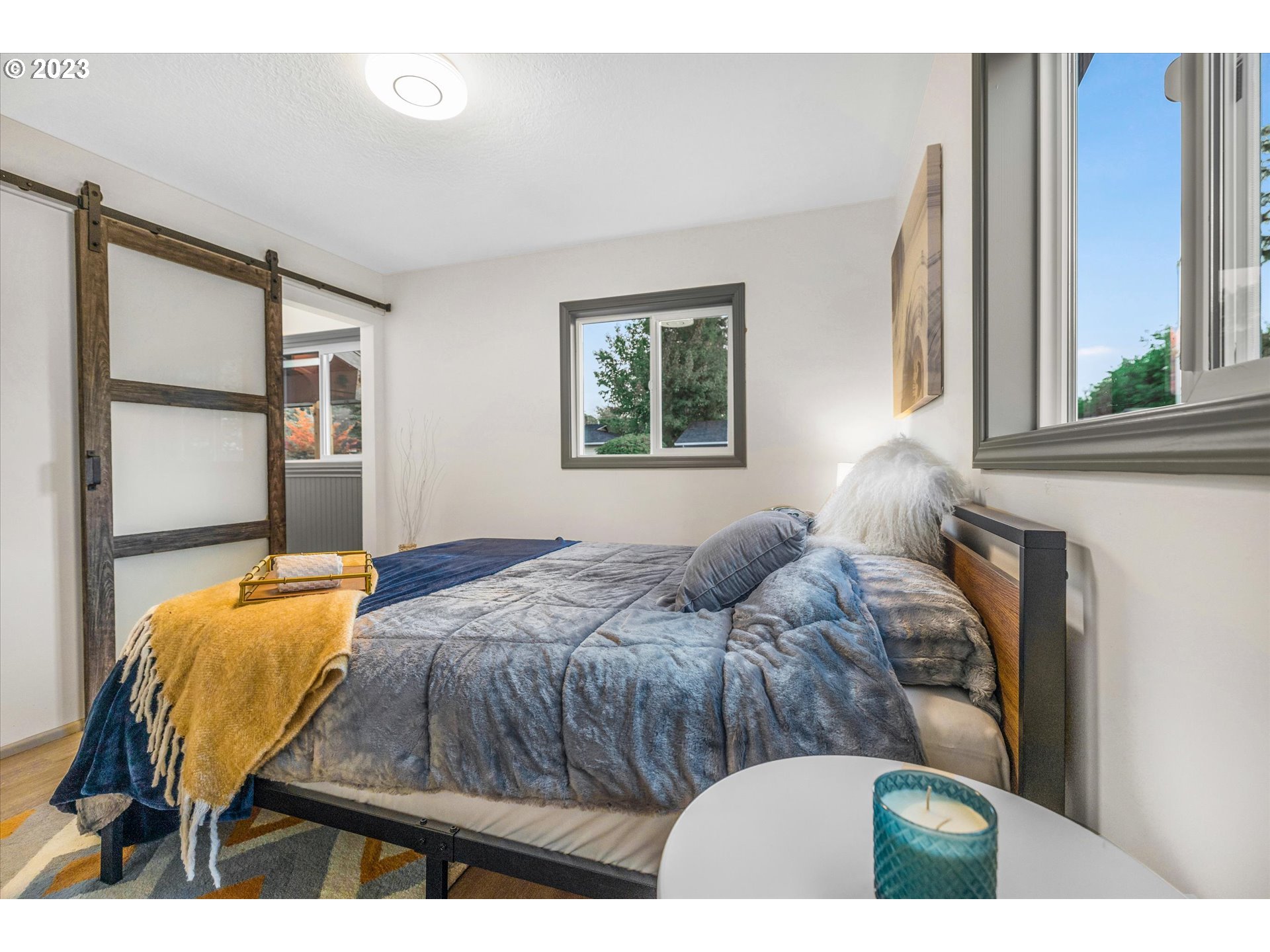 16331 Southeast Salmon Street Portland, OR 97233 - Photo 29 of 40 a bedroom with bed and window