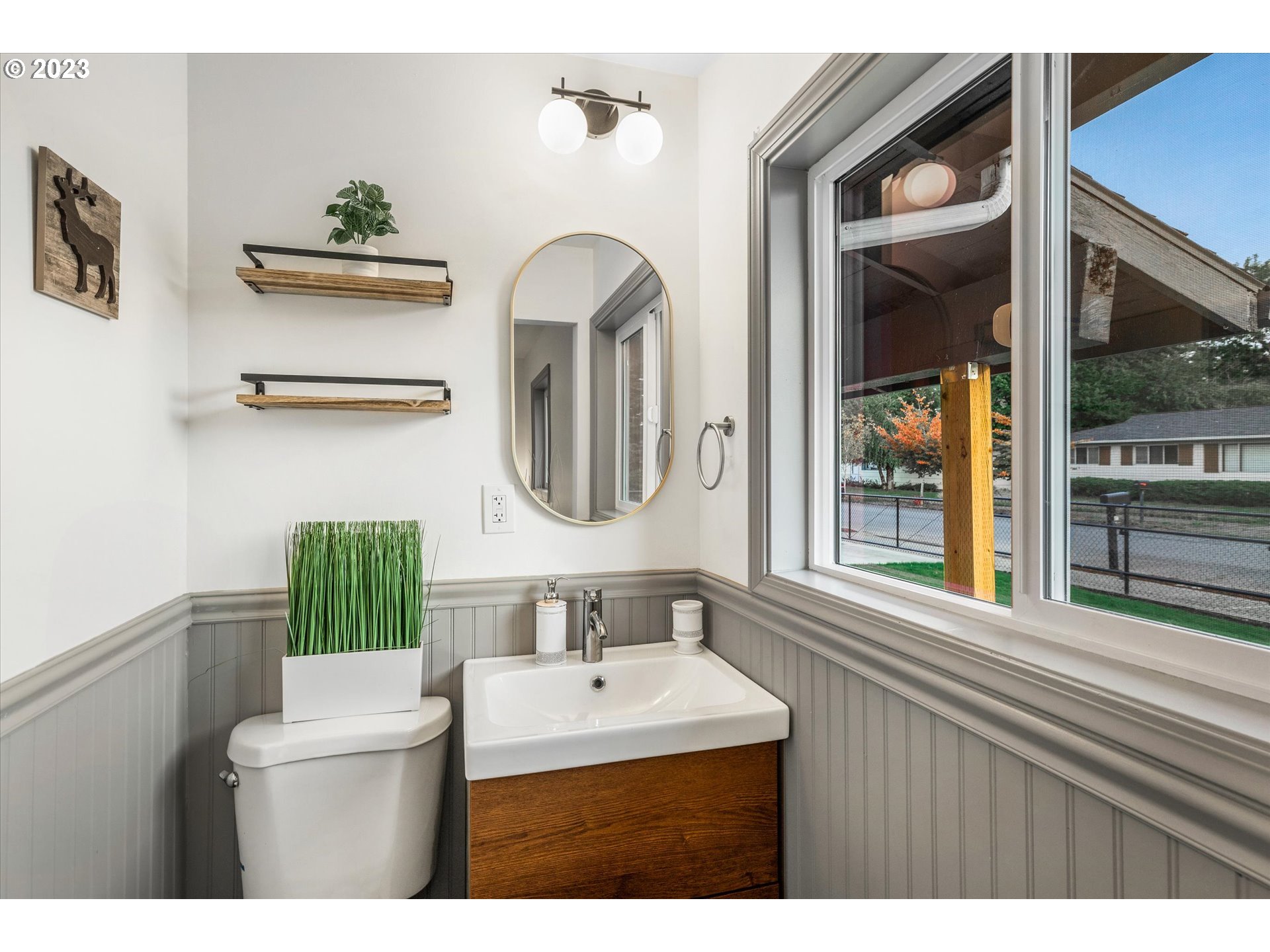 16331 Southeast Salmon Street Portland, OR 97233 - Photo 30 of 40 a bathroom with a sink mirror and toilet