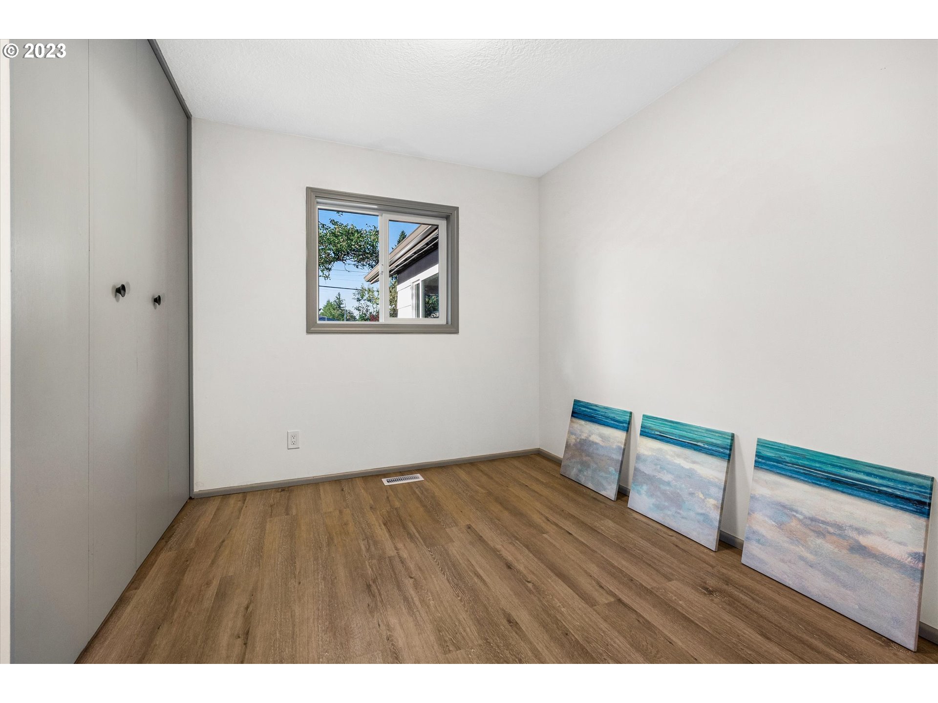16331 Southeast Salmon Street Portland, OR 97233 - Photo 34 of 40 a view of an empty room with wooden floor