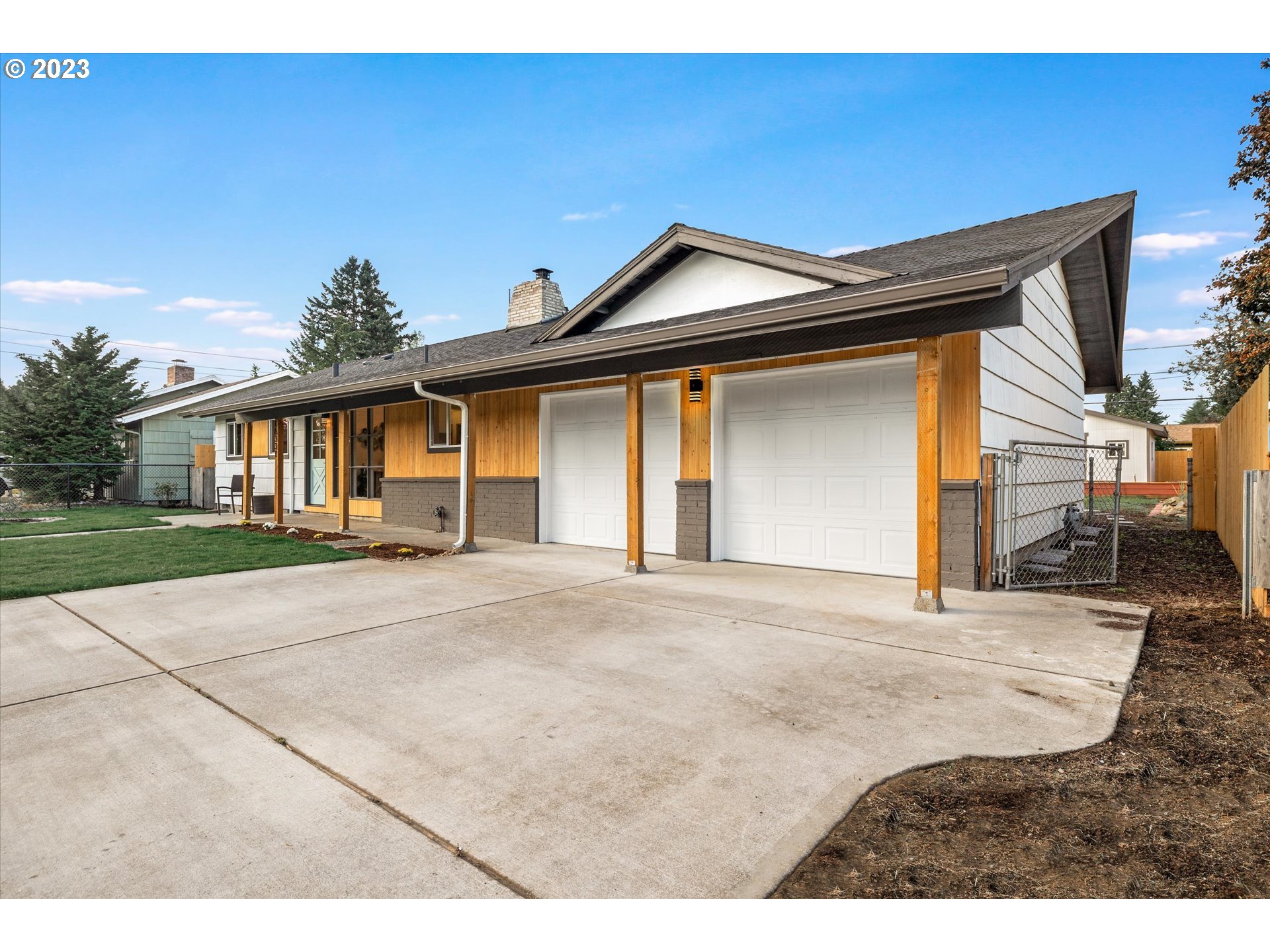 16331 Southeast Salmon Street Portland, OR 97233 - Photo 4 of 40 a front view of a house with a yard