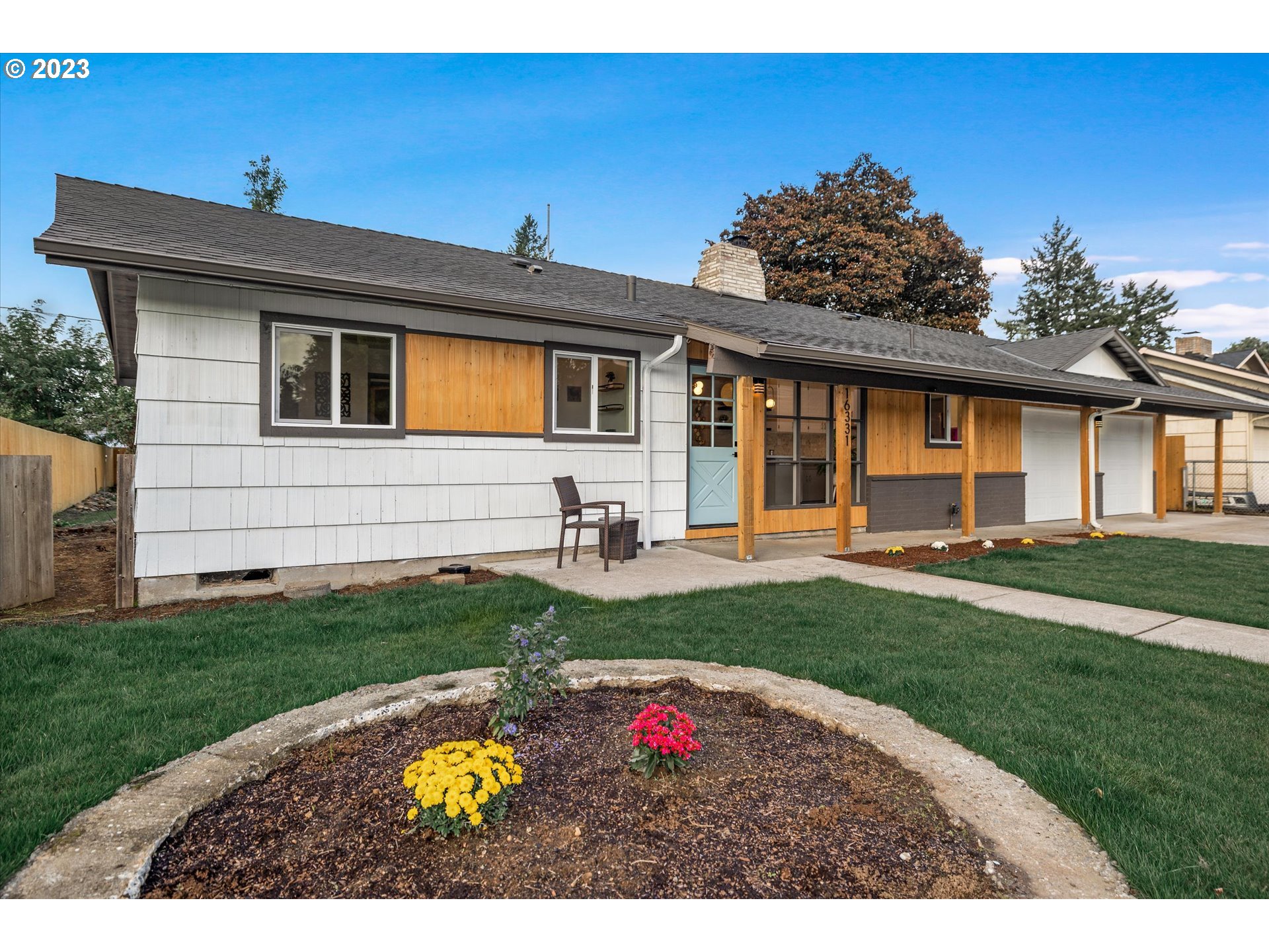 16331 Southeast Salmon Street Portland, OR 97233 - Photo 5 of 40 a view of house with outdoor space and garden