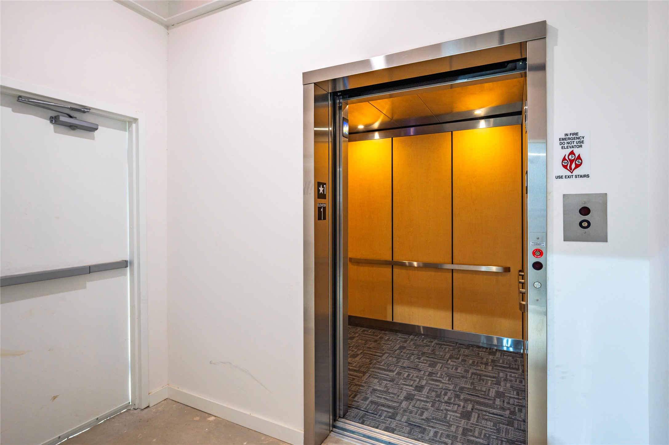 119 Kirby Road, Unit 5205 Seabrook, TX 77586 - Photo 45 of 46 Modern elevator with sleek wood paneling, providing convenient access and a touch of sophistication.