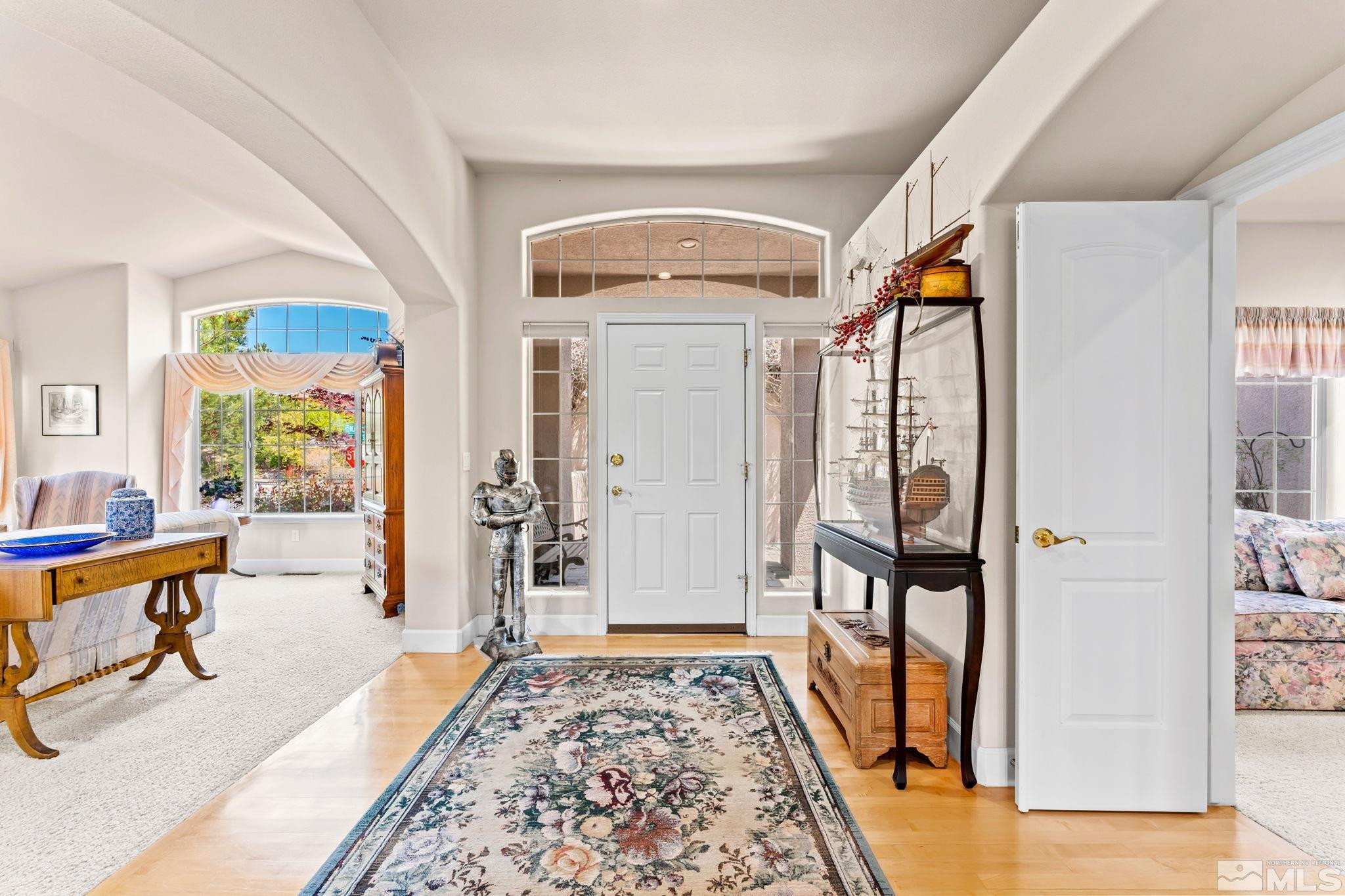 3301 Sierra Crest Way Reno, NV 89519 - Photo 5 of 37 a view of an entryway with wooden floor and windows
