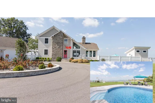 a view of a swimming pool and a yard