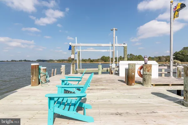 a view of a patio with a table and chairs