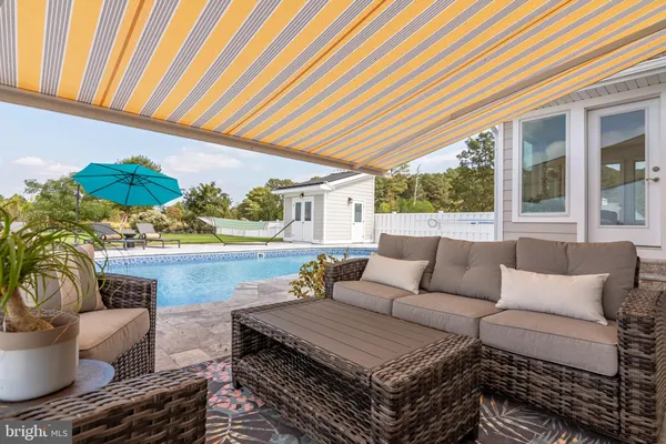 a view of a swimming pool and an ocean view