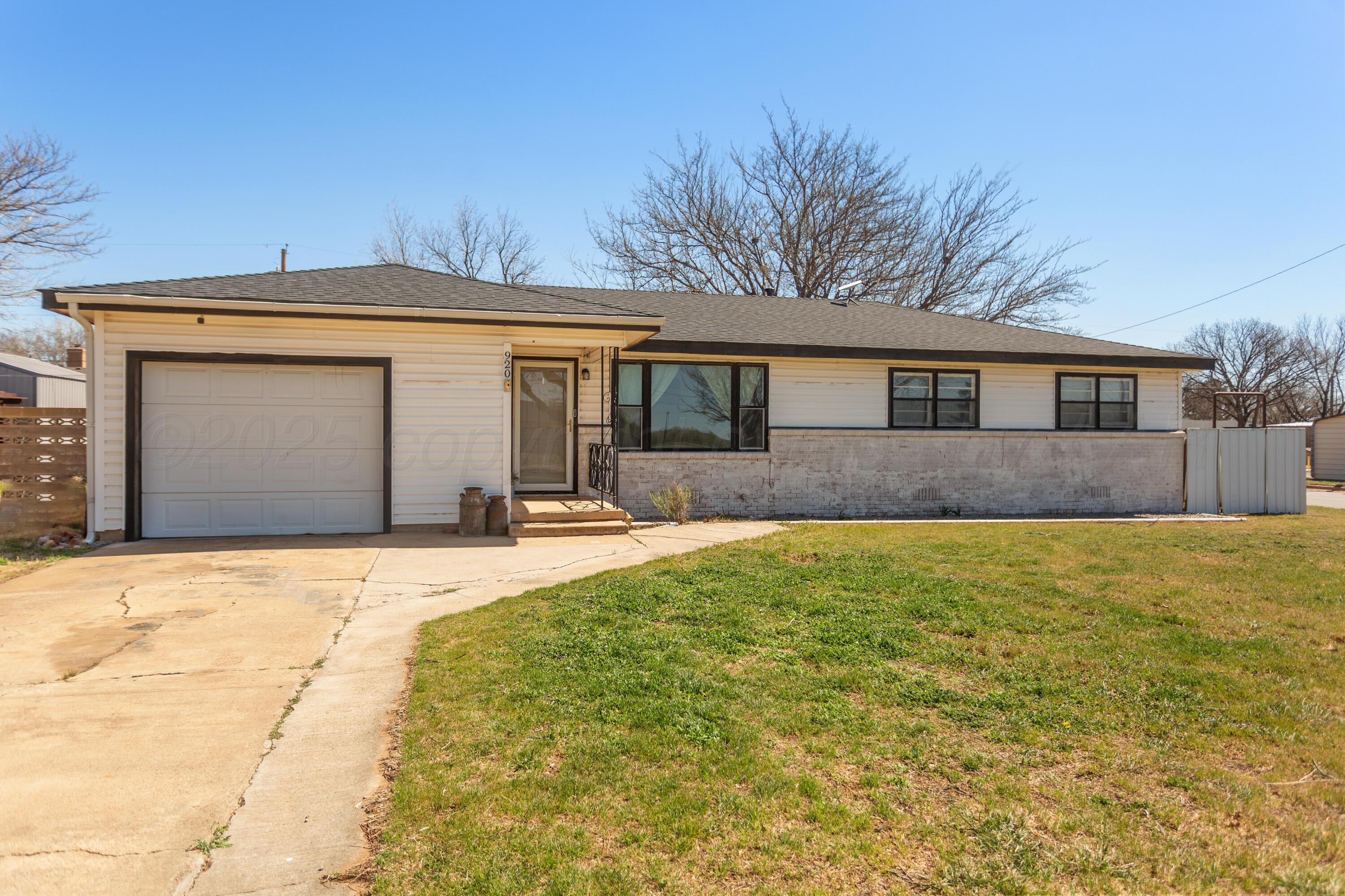 920 South Madden Street Shamrock, TX 79079 - Photo 2 of 39 a front view of a house with yard and trees