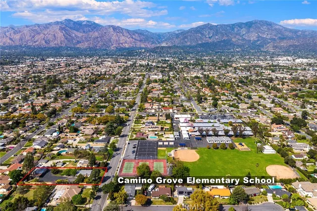 an aerial view of residential houses and outdoor space