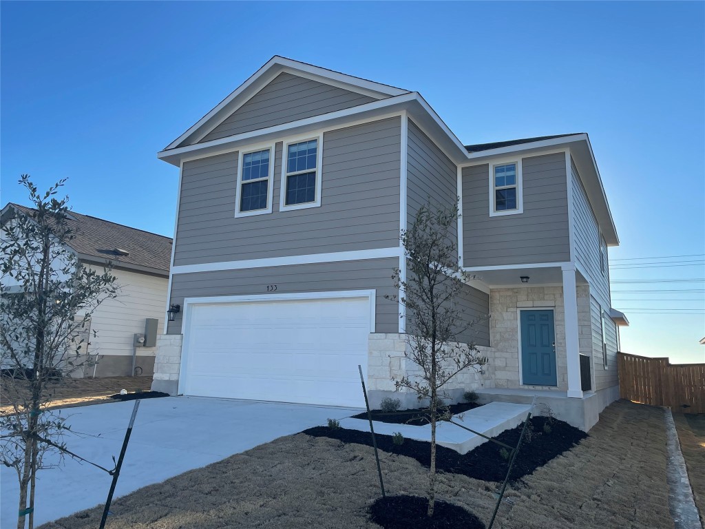 133 Old Stagecoach Road Jarrell, TX 76537 - Photo 1 of 23 a front view of a house with garden