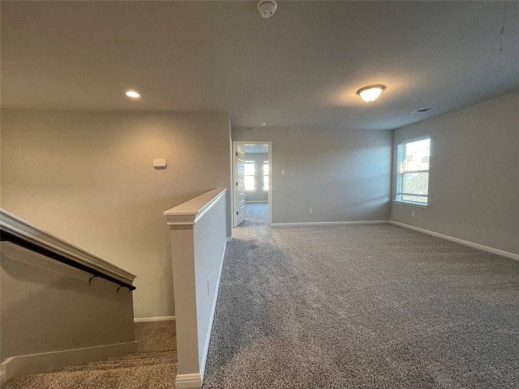 133 Old Stagecoach Road Jarrell, TX 76537 - Photo 13 of 23 a view of hallway with stairs