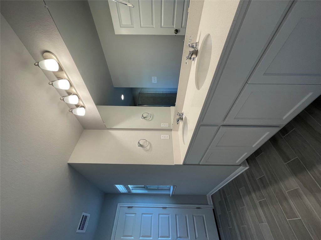 133 Old Stagecoach Road Jarrell, TX 76537 - Photo 15 of 23 a bathroom with a double vanity sink and a mirror