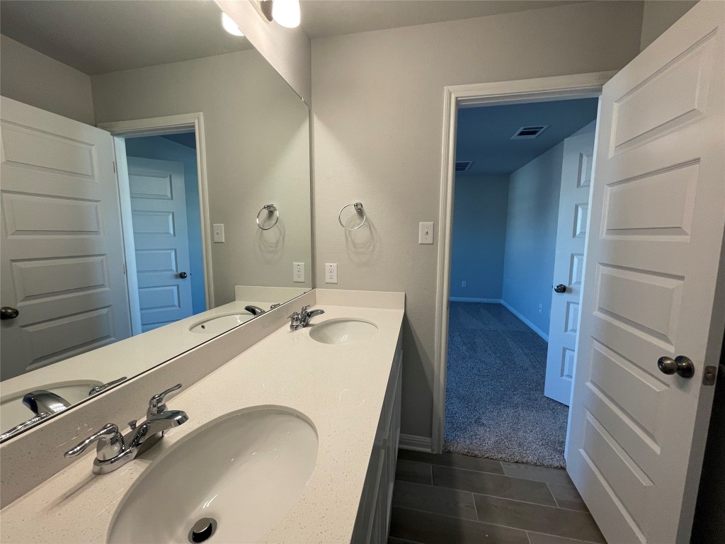 133 Old Stagecoach Road Jarrell, TX 76537 - Photo 17 of 23 a bathroom with a tub sink and mirror