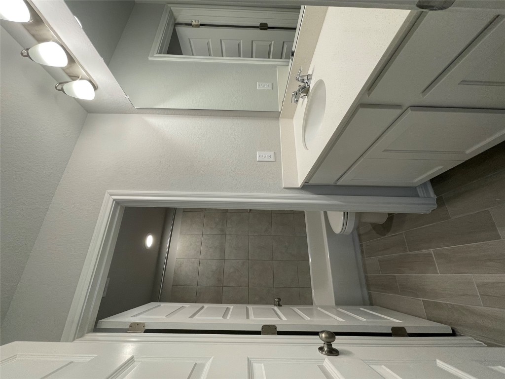 133 Old Stagecoach Road Jarrell, TX 76537 - Photo 19 of 23 a bathroom with a sink a toilet and shower