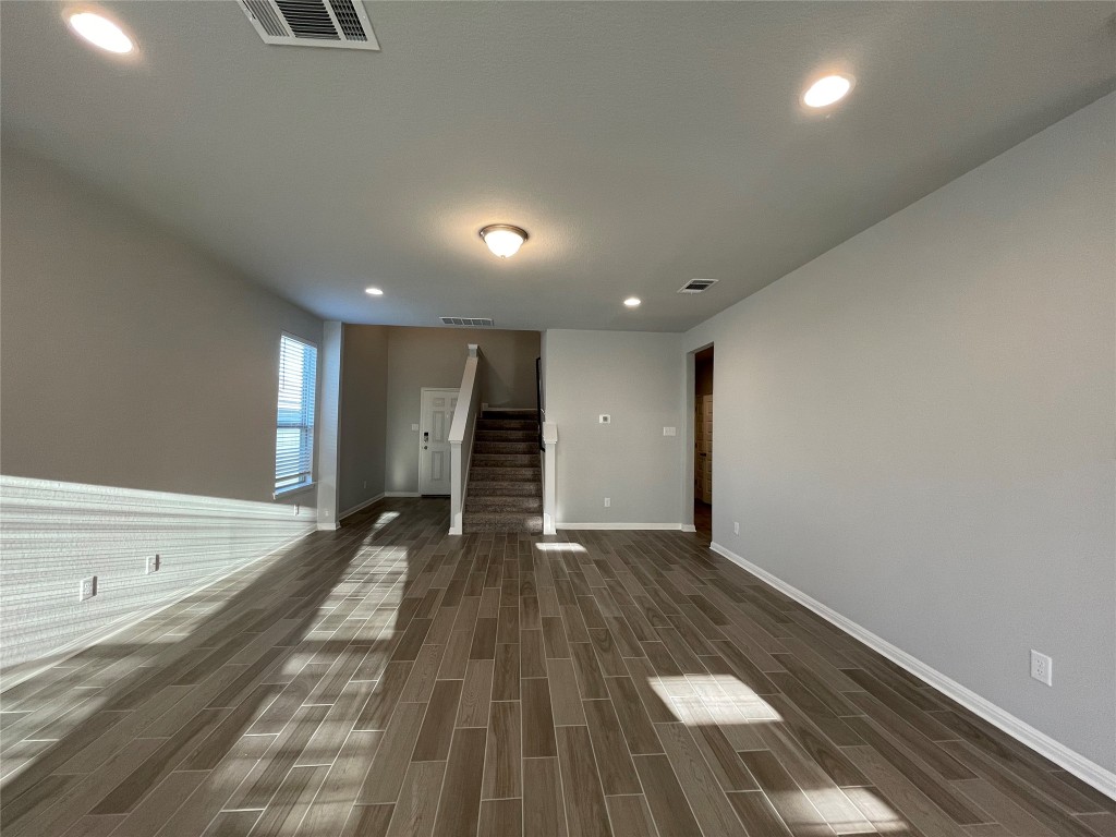 133 Old Stagecoach Road Jarrell, TX 76537 - Photo 8 of 23 a view of an empty room with wooden floor