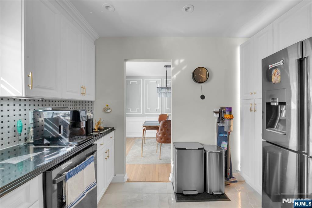 170 Tenafly Road Englewood, NJ 07631 - Photo 12 of 40 a kitchen with stainless steel appliances granite countertop a refrigerator a stove a sink and a refrigerator