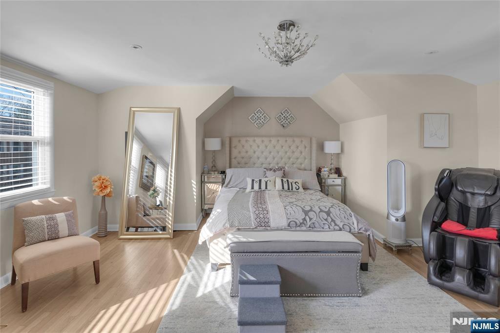 170 Tenafly Road Englewood, NJ 07631 - Photo 17 of 40 a view of living room with furniture and a chandelier