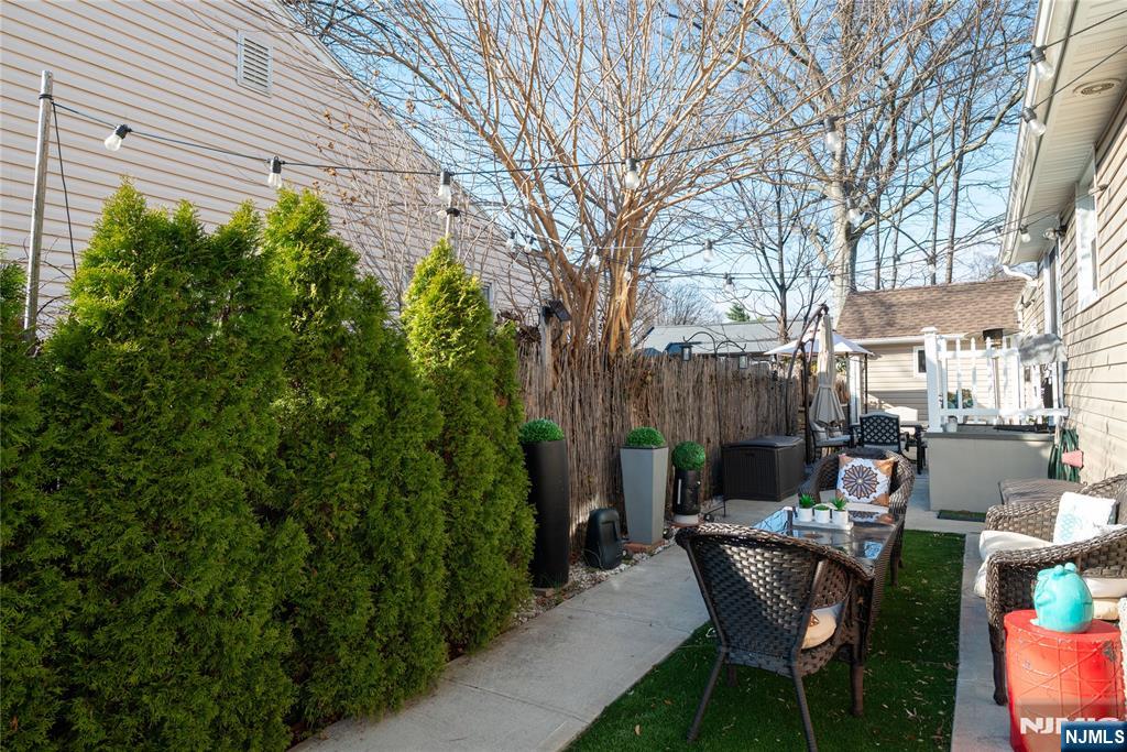 170 Tenafly Road Englewood, NJ 07631 - Photo 30 of 40 a patio with table and chairs and potted plants