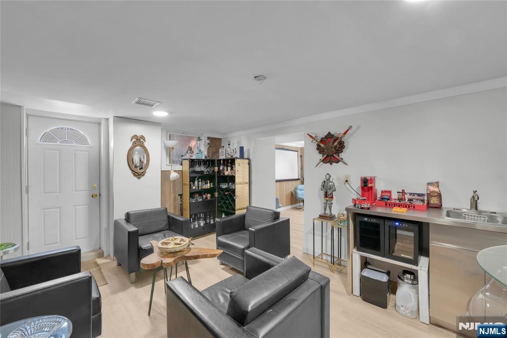 170 Tenafly Road Englewood, NJ 07631 - Photo 34 of 40 a living room with furniture and a wooden floor