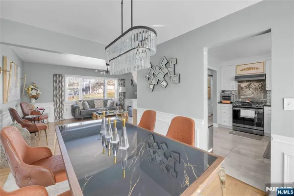 a kitchen with granite countertop a sink stove and cabinets