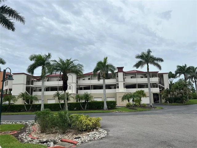 a front view of multiple houses with yard