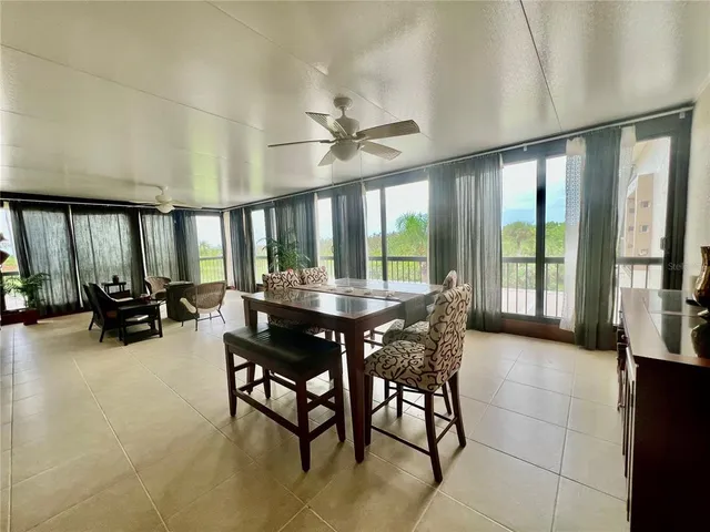 a view of a dining room with furniture window and outside view