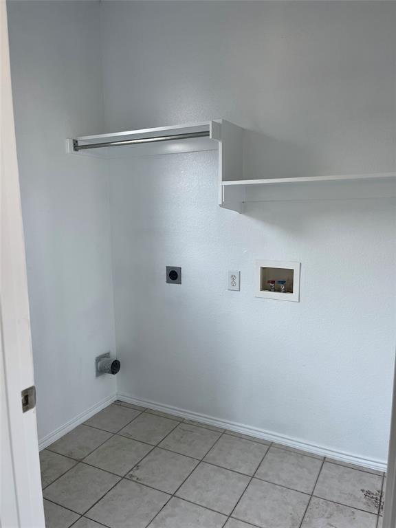 7929 Park Ridge Drive Fort Worth, TX 76137 - Photo 11 of 13 Utility room featuring neutral wall finishes and tiled flooring