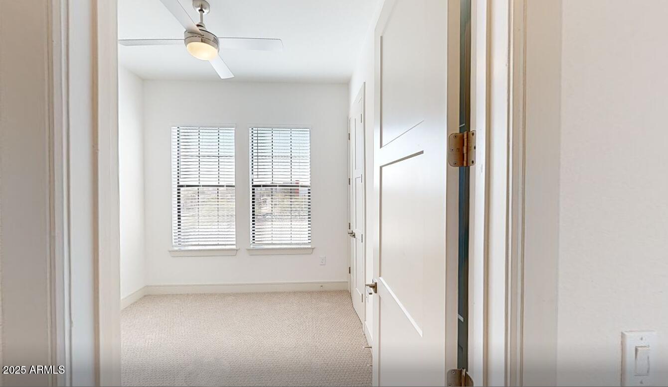 98 South River Drive, Unit C1 Tempe, AZ 85288 - Photo 10 of 20 an empty room with windows and closet