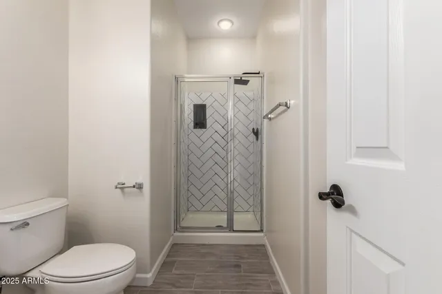 a bathroom with a granite countertop shower