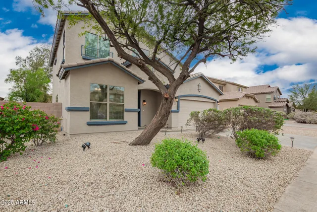 front view of a house with a yard