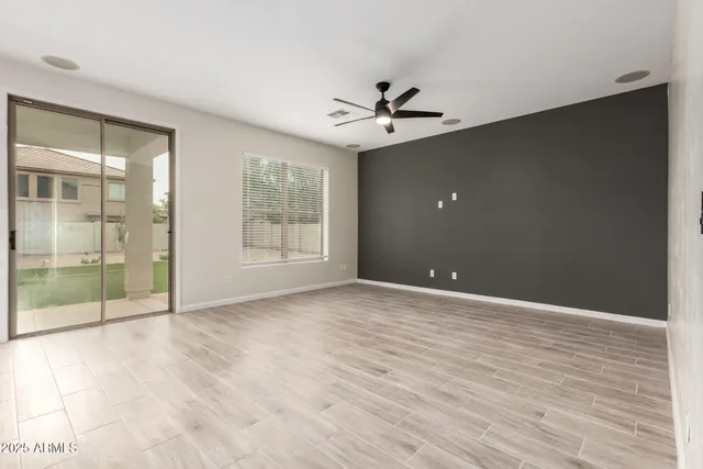 a view of an empty room with glass door