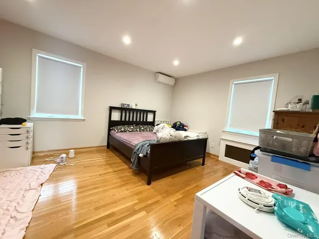 a spacious bedroom with a bed and a couch