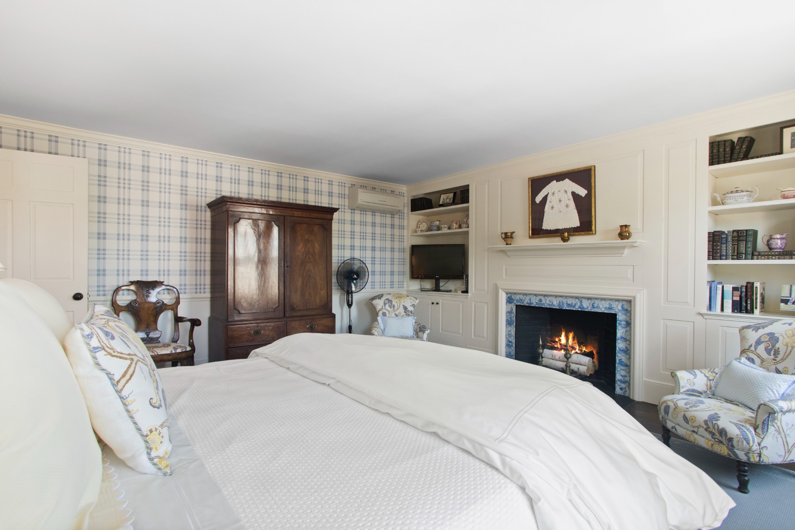 19 Orange Street Nantucket, MA 02554 - Photo 40 of 85 a bedroom with a bed and a fireplace