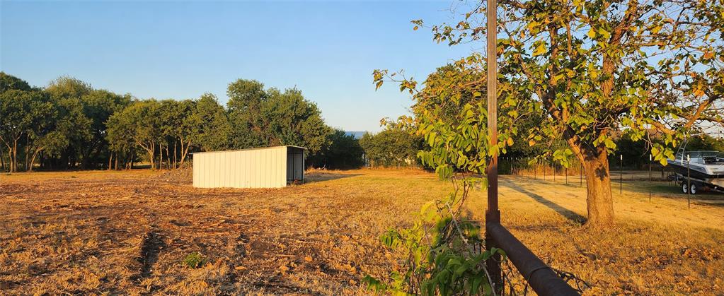 592 Pike Road Gunter, TX 75058 - Photo 3 of 40 View of yard with an outbuilding and a shed