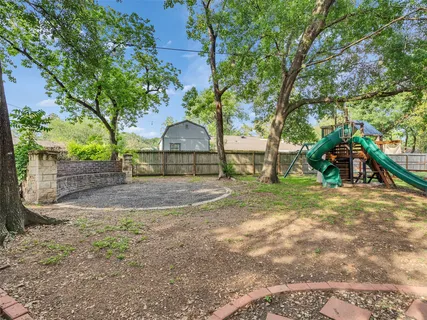 a view of a house with basketball court