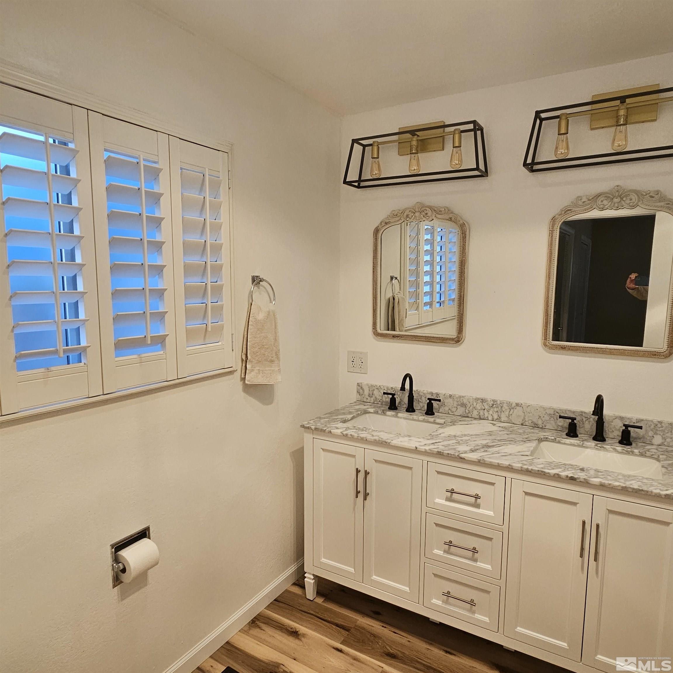 14430 Rancheros Drive Reno, NV 89521 - Photo 20 of 39 a bathroom with double sink and a mirror