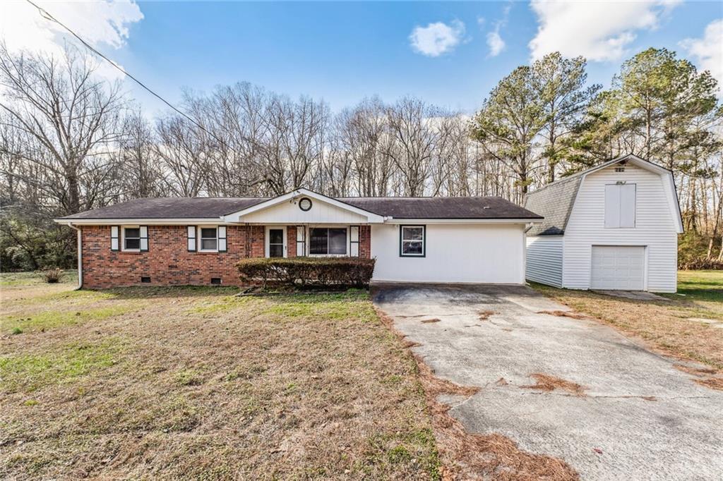 3288 Hopkins Road Powder Springs, GA 30127 - Photo 1 of 1 a front view of a house with a yard