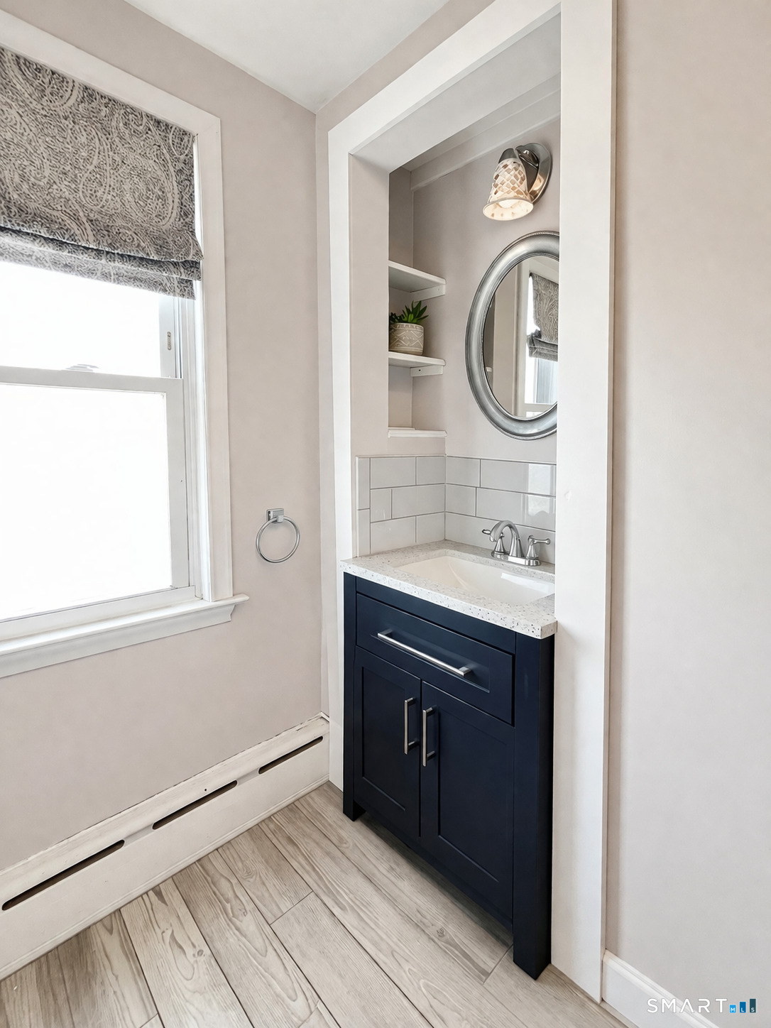 31 Somerset Street Wethersfield, CT 06109 - Photo 7 of 18 a bathroom with a sink and a mirror
