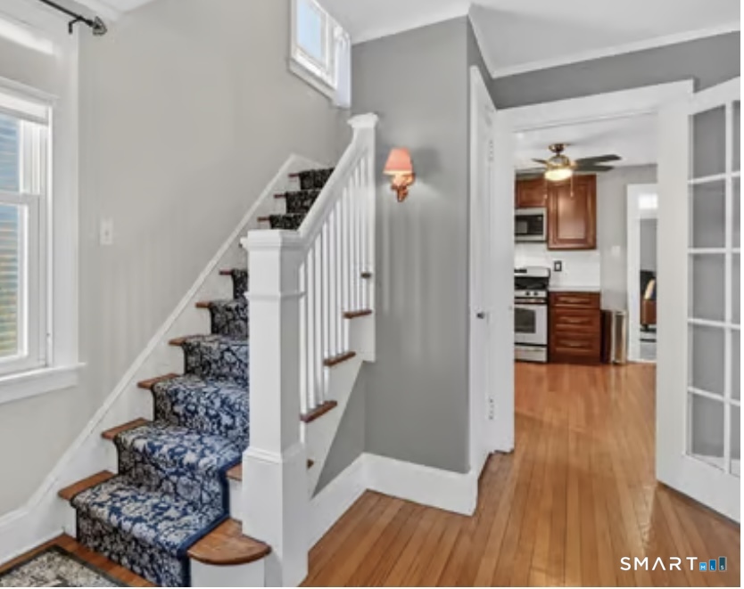 31 Somerset Street Wethersfield, CT 06109 - Photo 8 of 18 a view of entryway and hall with wooden floor