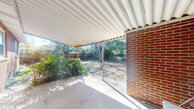 a kitchen with stainless steel appliances a stove a sink and a refrigerator with wooden floor