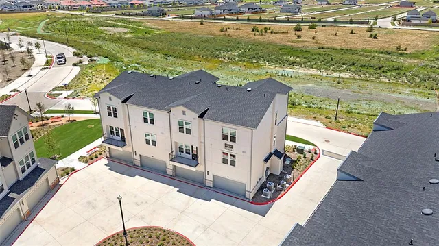 a aerial view of a house with a ocean view