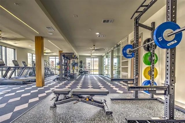 a room with lots of furniture and view of living room