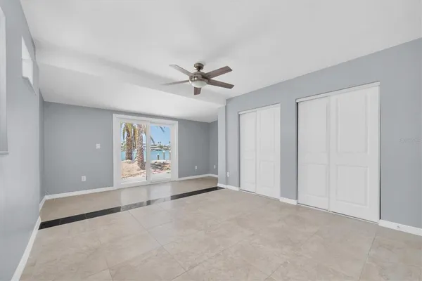 a view of a hallway with wooden floor and a fireplace