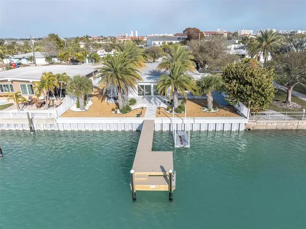 an aerial view of a house with lake view